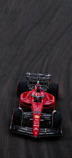 Ferrari F1 Racingon Track.jpg Wallpaper