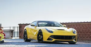 Ferrari F12 Berlinetta In Motion On A Road Wallpaper