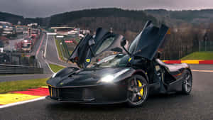 Ferrari Laferrari Showcasing Its Sleek Design And Powerful Performance Wallpaper