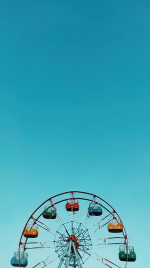 Ferris Wheel On Baby Blue Sky Wallpaper