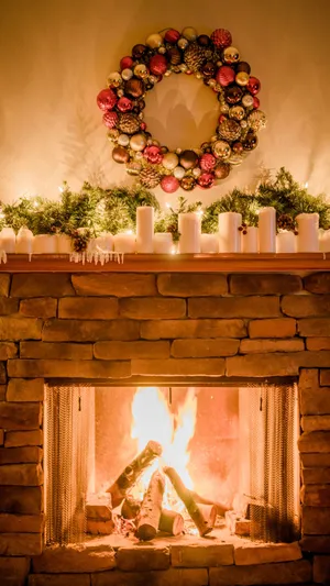 Festive Christmas Fireplace Warmth Wallpaper