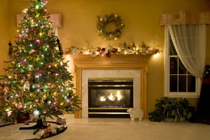 Festive Christmas Treeand Fireplace Decor Wallpaper