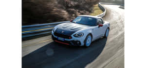 Fiat 124 Spider: Elegance On The Road Wallpaper