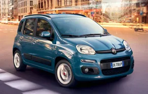 Fiat Panda Driving On A Road During Daytime Wallpaper