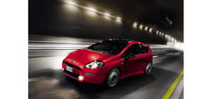 Fiat Punto In A Scenic Landscape Wallpaper