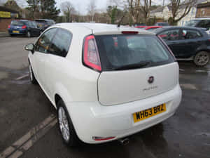 Fiat Punto In Mountain Landscape Wallpaper