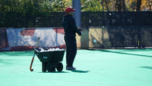 Field Hockey Balls On Wheelbarrow Wallpaper