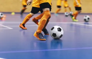 Fierce Indoor Soccer Match In Progress Wallpaper
