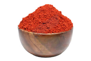 Fiery Red Chili Powder In A Bowl Wallpaper