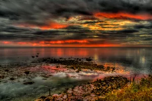 Fiery Sunset Over Calm Seas H D R Wallpaper