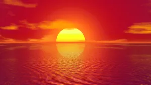 Fiery Sunset Over Ocean Wallpaper