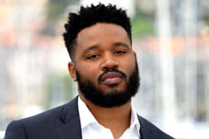 Filmmaker Ryan Coogler Attending A Red Carpet Event Wallpaper