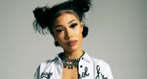 Find The Light In Darkness And Stay Motivated With Coi Leray. Wallpaper