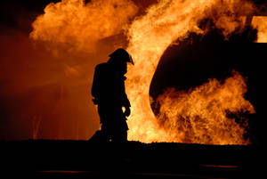 Firefighter In Ghastly Fire Wallpaper