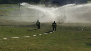 Firefighters Practicing Fire Hoses Wallpaper