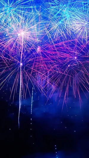 Fireworks In The Sky With Blue And Purple Colors Wallpaper