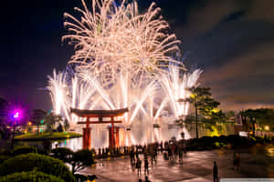 Fireworks Over A Torii Gate In The Night Sky Wallpaper