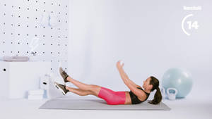 Fit Woman Performing Pilates Wallpaper