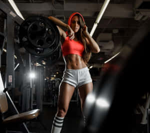 Fitness Focused Female Gym Workout Aesthetic.jpg Wallpaper