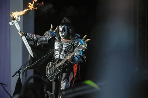 Flaming Guitar Rock Performance Wallpaper