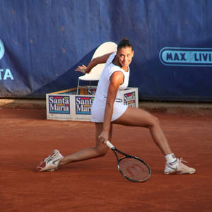 Flavia Pennetta In A Stunning White Tennis Outfit Wallpaper