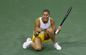 Flavia Pennetta Kneeling On Court Wallpaper