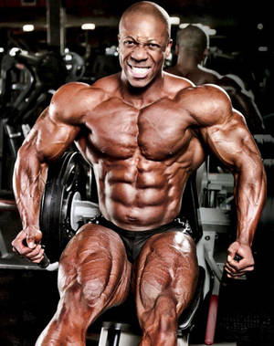 Flex Wheeler During An Intense Leg Workout Wallpaper