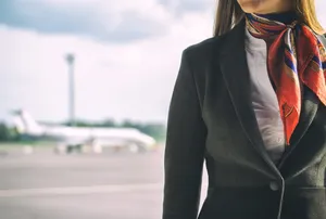 Flight Attendant Ready To Serve Wallpaper