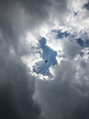 Flying Through The Clouds Wallpaper