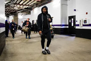 Focused Athlete Walking Through Tunnel Wallpaper