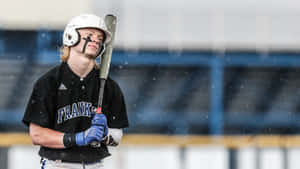 Focused Baseball Player During Rainy Game Wallpaper