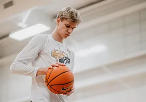 Focused Basketball Player Preparation Wallpaper