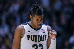 Focused Basketball Player Purdue Uniform Wallpaper