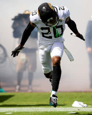 Focused Cornerback In Action Wallpaper