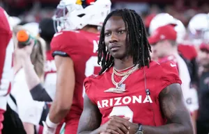 Focused Football Player Arizona Uniform Wallpaper