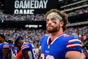 Focused Football Player Before Game Wallpaper