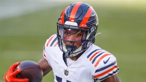 Focused Football Player Catching Ball Wallpaper