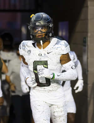 Focused Football Player Entering Stadium Wallpaper