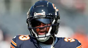 Focused Football Player Helmet Visor Wallpaper