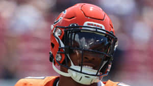 Focused Football Player Helmet Visor Wallpaper