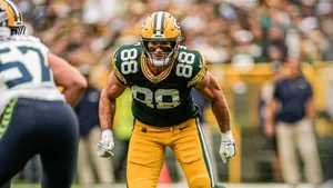 Focused Football Player Intensity Wallpaper