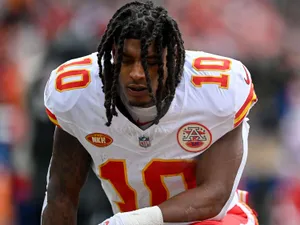 Focused Football Player Isiah Pacheco Wallpaper