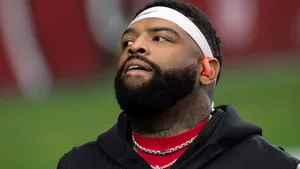 Focused Football Player Looking Upward Wallpaper