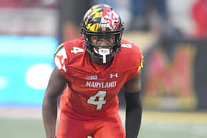 Focused Football Player Maryland Uniform Wallpaper