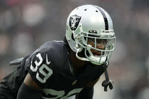 Focused Football Player Nate Hobbs Wallpaper