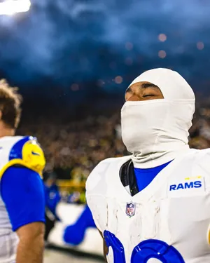 Focused Football Player Night Game Wallpaper