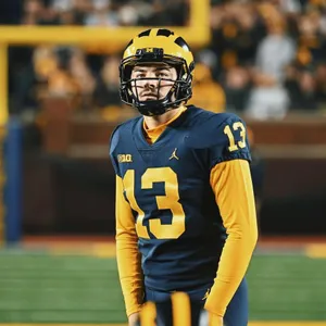 Focused Football Player Number13 Wallpaper