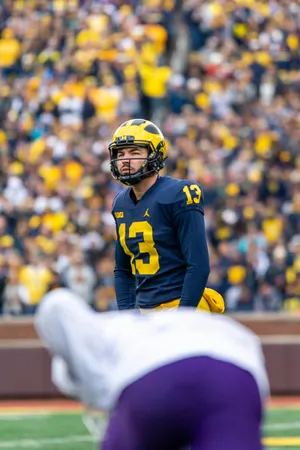 Focused Football Player Number13 Wallpaper