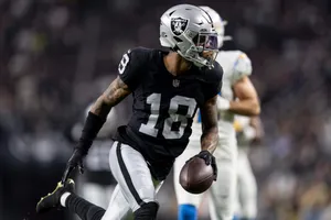 Focused Football Player Number18 Wallpaper