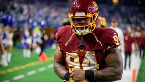 Focused Football Player Number94 Wallpaper